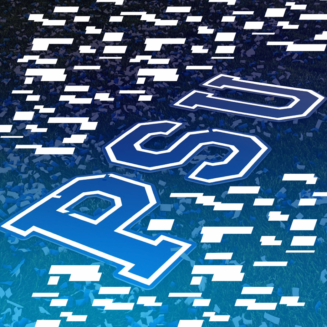Large PSU letters on grassy field covered in confetti