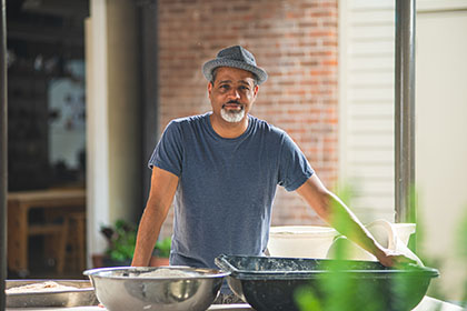 Diverse male poses near Penn State ceramics studio.