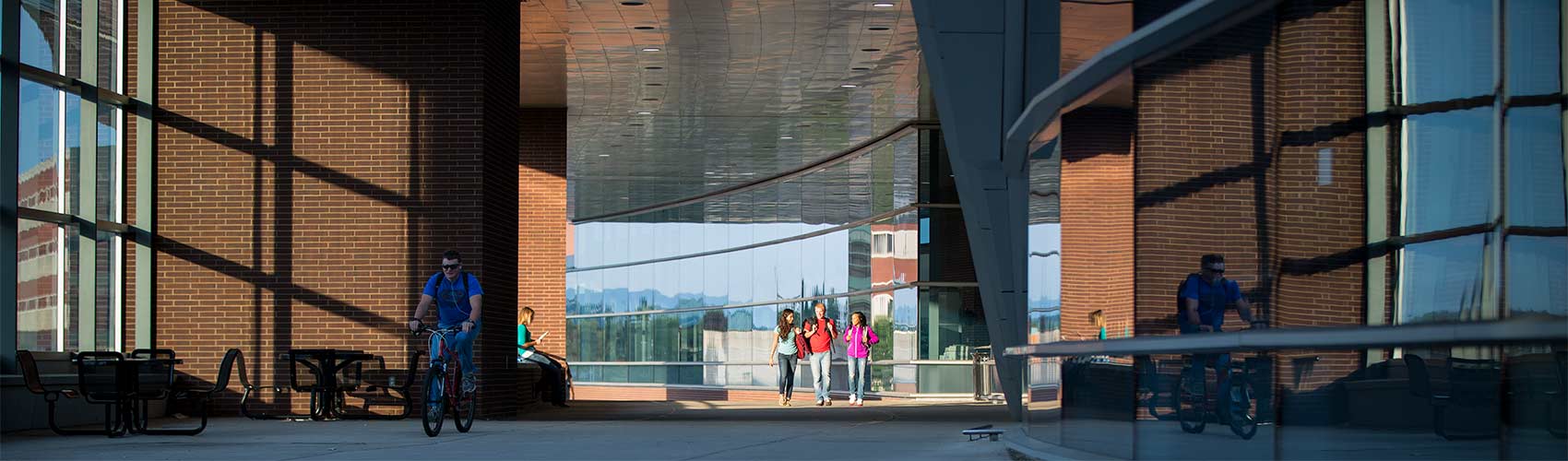 students walking across the IST bridge